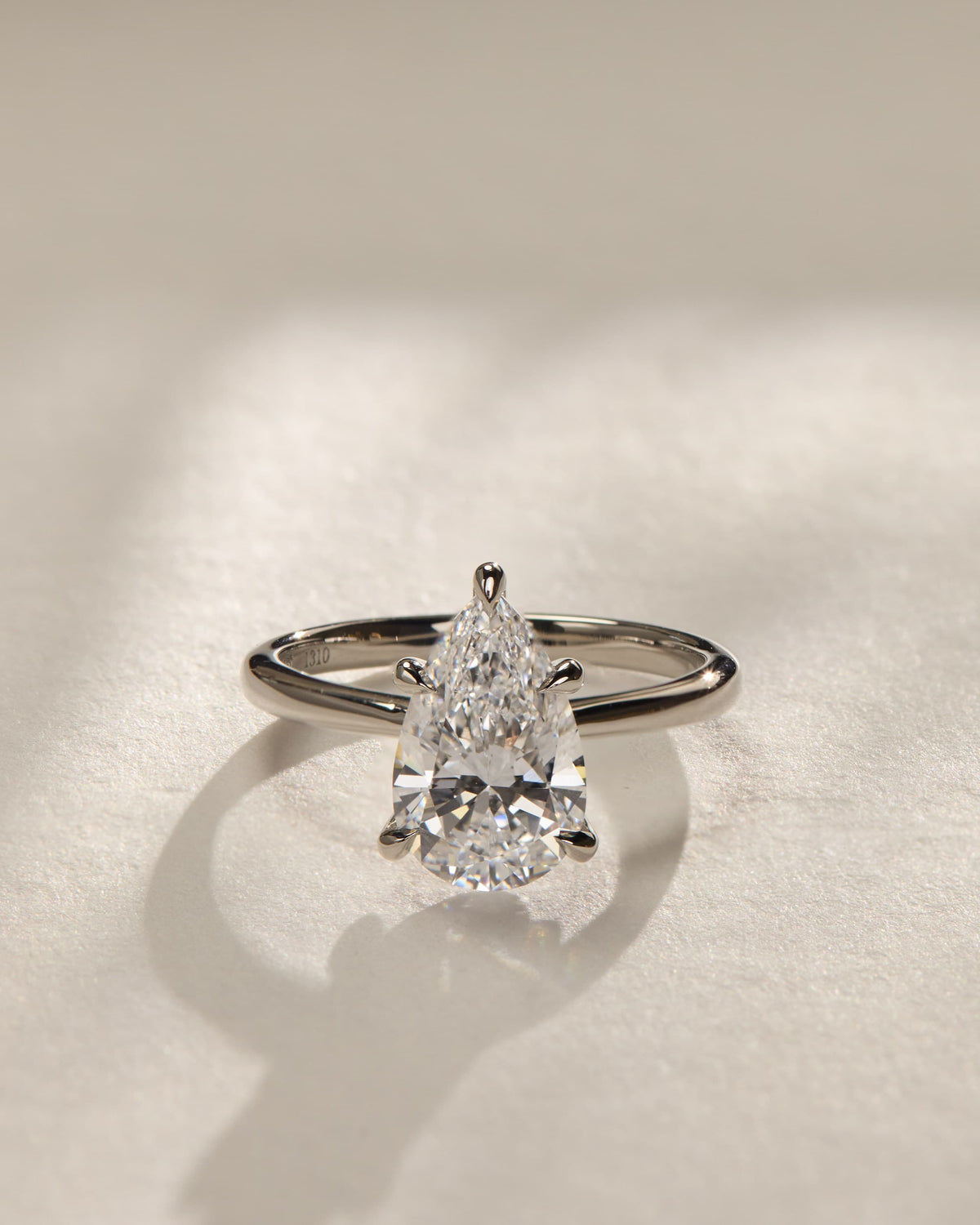 Aspen - Pear Claw Solitaire with Pinched Tapered Band and Cathedral Low Setting Engagement Ring - Yellow Gold