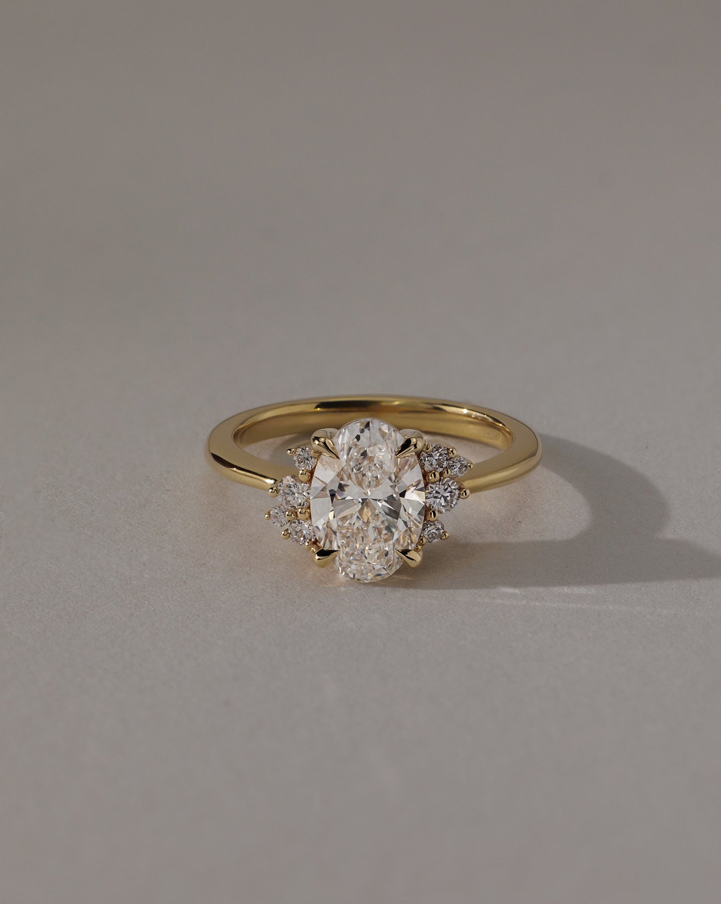 Esther - Oval Claw Solitaire with Clustered Round Opposing Shoulder Stones Engagement Ring - Platinum - Lifestyle