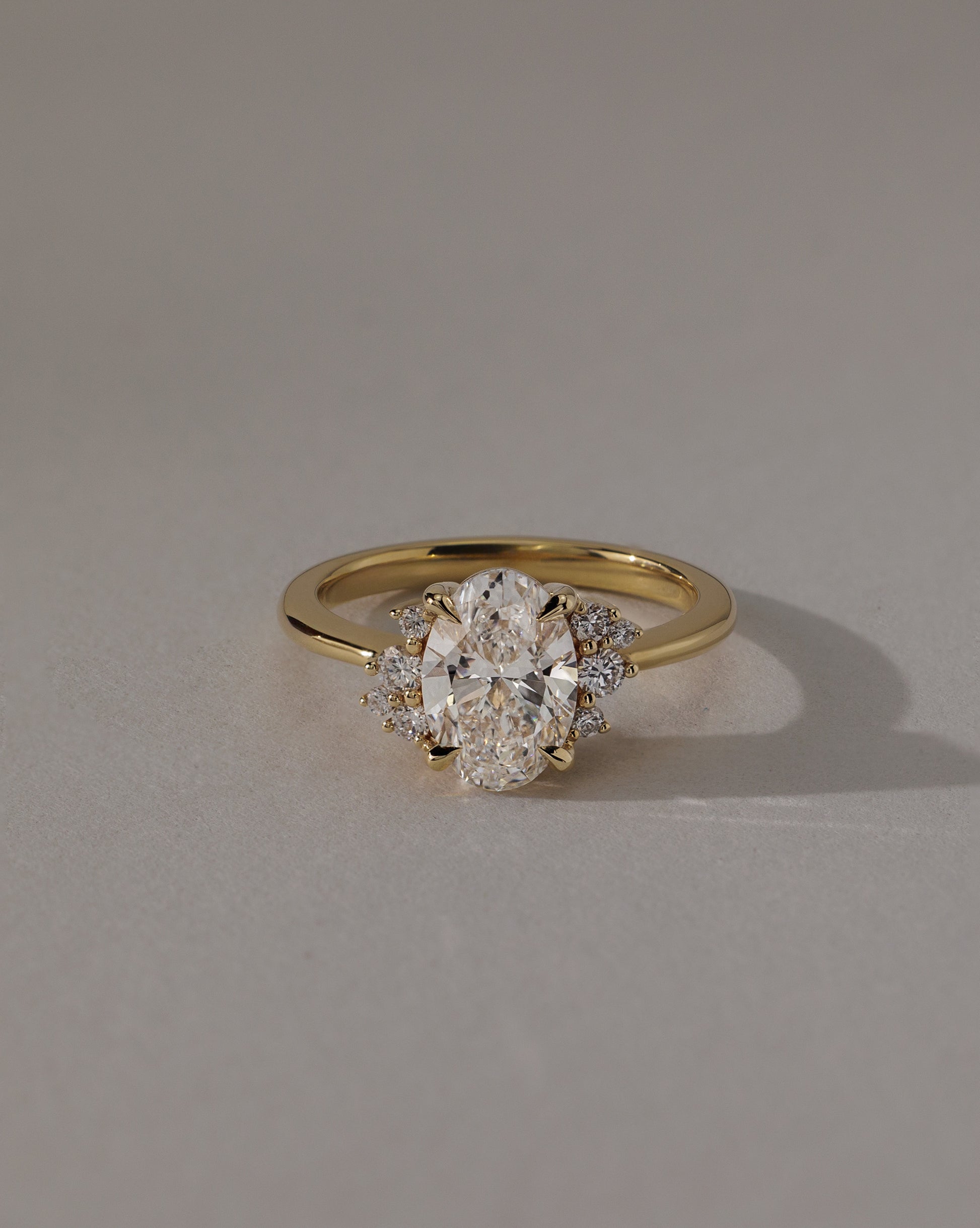 Esther - Oval Claw Solitaire with Clustered Round Opposing Shoulder Stones Engagement Ring - Platinum - Lifestyle