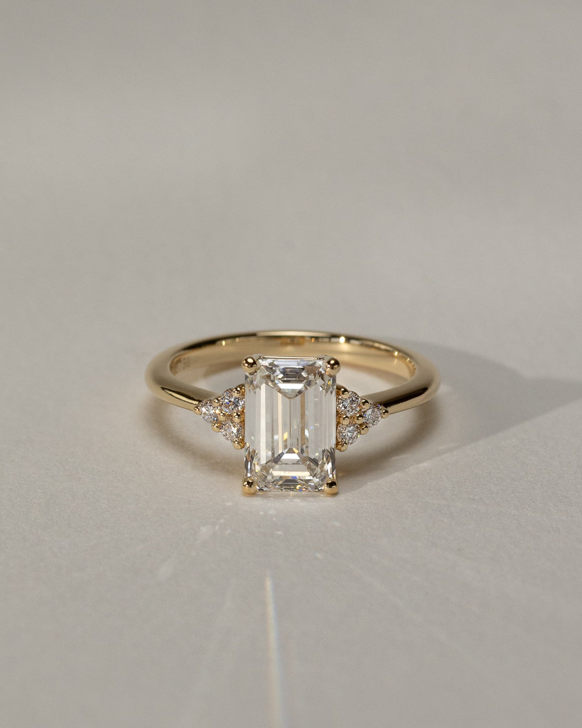 Martina - Emerald Claw Solitaire with Round Shoulder Stones Engagement Ring - Rose Gold