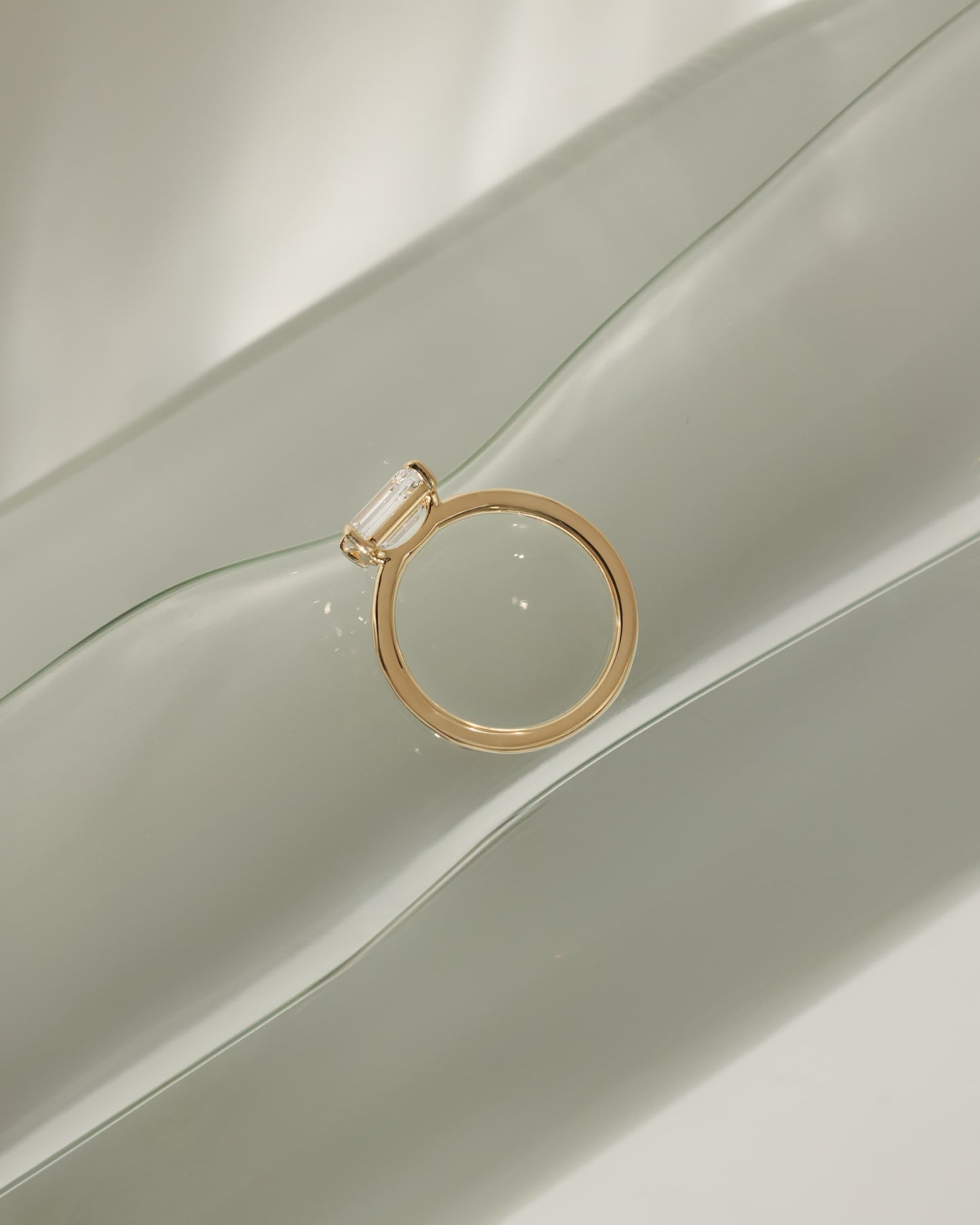 Evelyn - Emerald East West Claw Solitaire with Raised Basket Gallery Engagement Ring - Yellow Gold