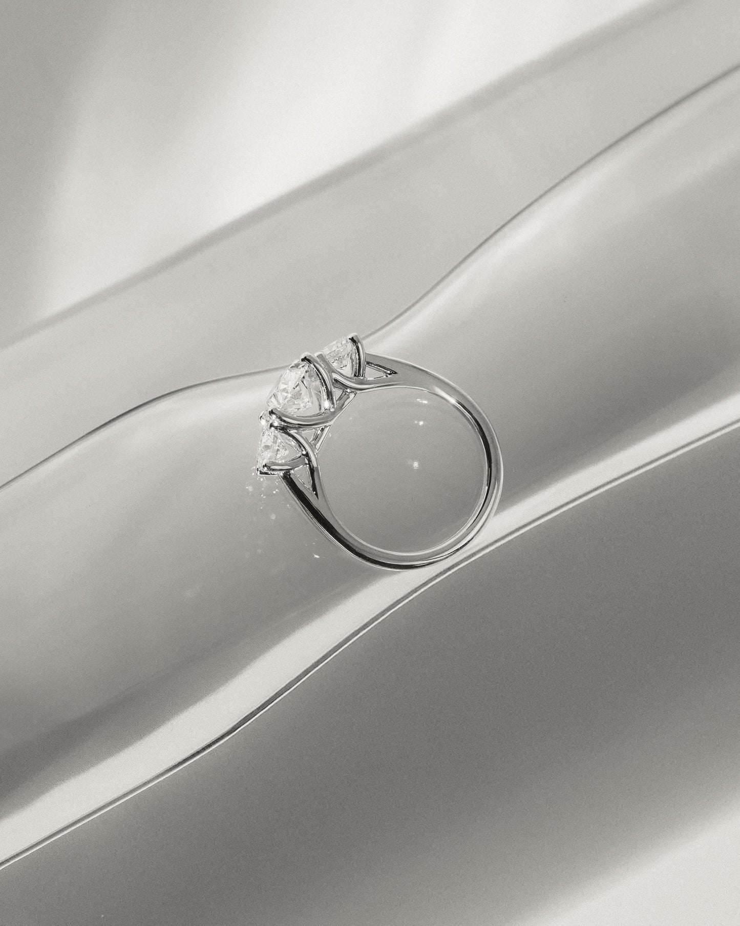 Grace - Oval Claw Trilogy with Round Side Stones, Open Trellis Gallery and Tapered Band Engagement Ring - Yellow Gold