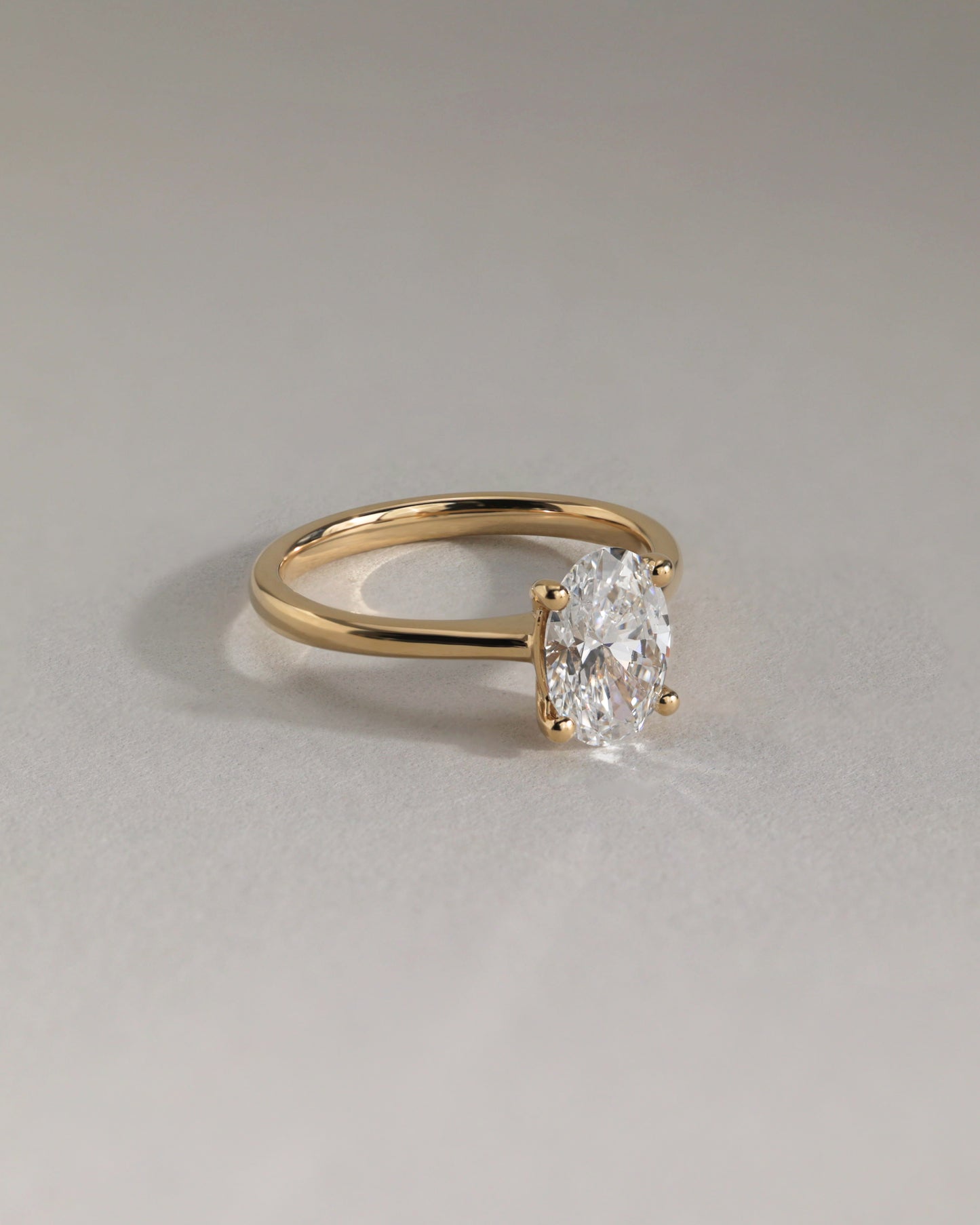 Emily - Oval Claw Solitaire with Pinched Tapered Band and Cathedral Low Setting Engagement Ring - Platinum - Lifestyle