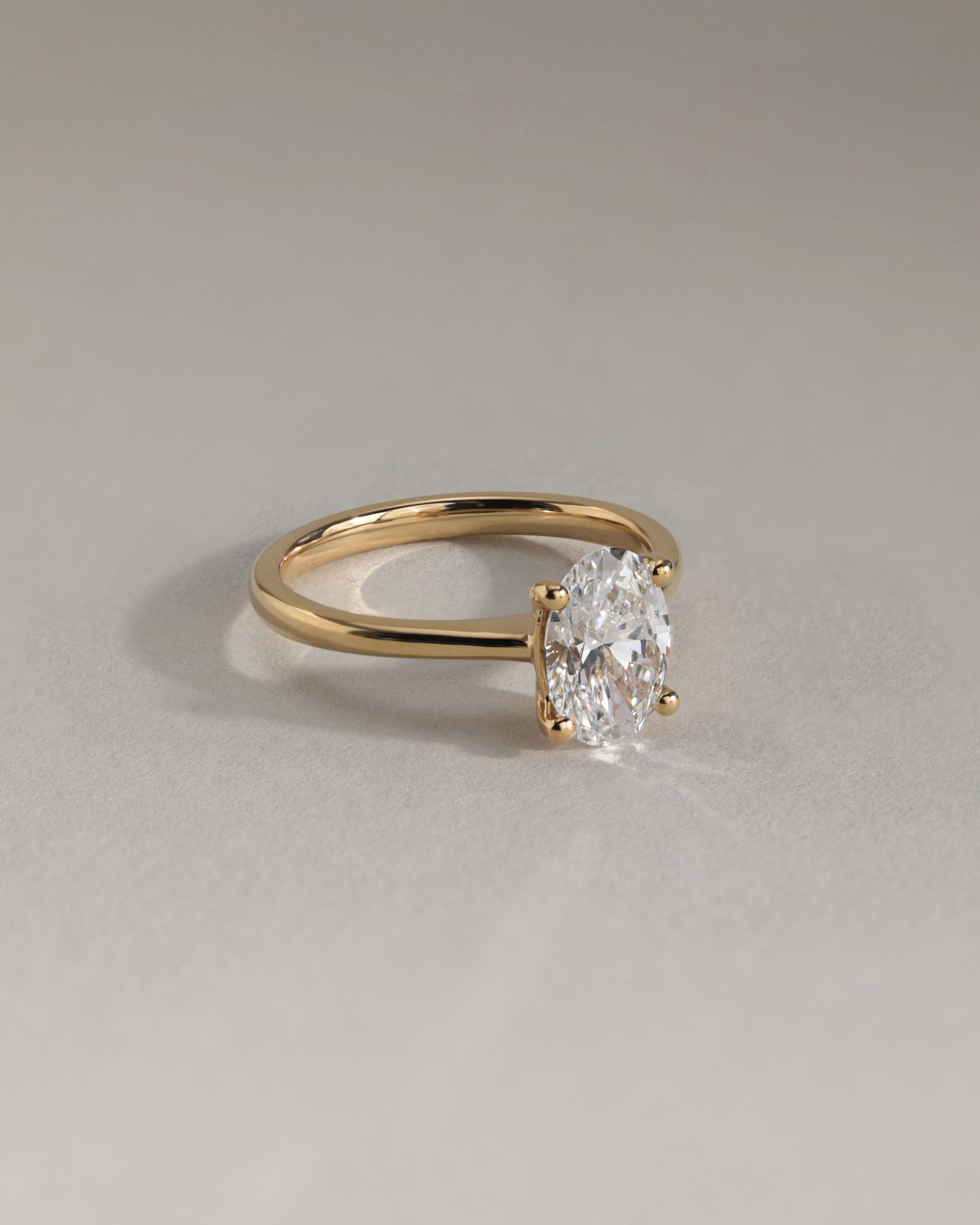Emily - Oval Claw Solitaire with Pinched Tapered Band and Cathedral Low Setting Engagement Ring - Platinum - Lifestyle