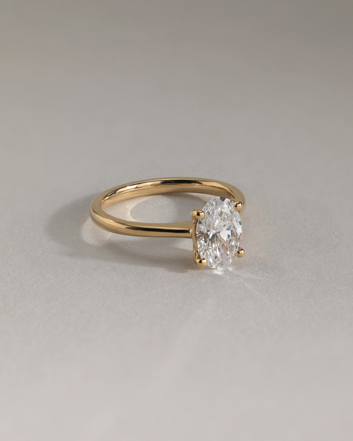 Emily - Oval Claw Solitaire with Pinched Tapered Band and Cathedral Low Setting Engagement Ring - White Gold
