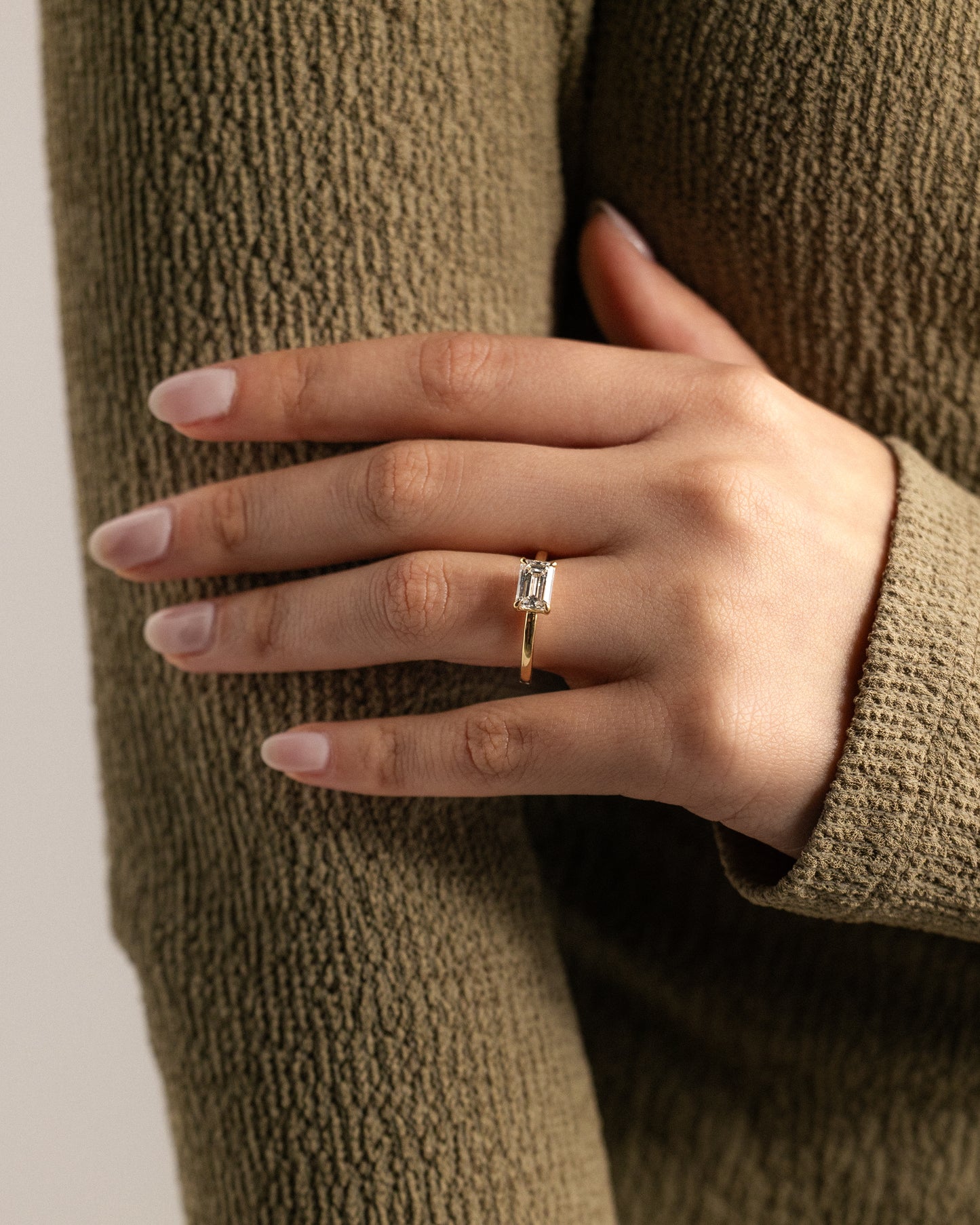 Evelyn - Emerald East West Claw Solitaire with Raised Basket Gallery Engagement Ring - Platinum - Lifestyle