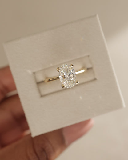 Emily - Oval Claw Solitaire with Pinched Tapered Band and Cathedral Low Setting Engagement Ring - Yellow Gold