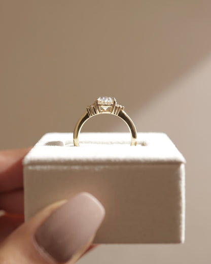Esther - Oval Claw Solitaire with Clustered Round Opposing Shoulder Stones Engagement Ring - Yellow Gold