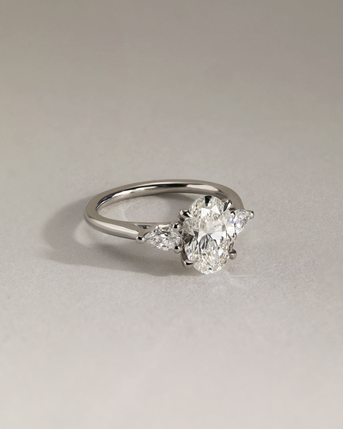 Amara - Oval Claw Trilogy with Pear Side Stones and Open Trellis Gallery Engagement Ring - Yellow Gold - yellow gold - Lara Jewels