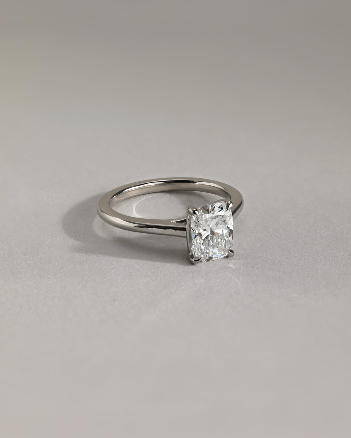 Kelsey - Elongated Cushion Claw Solitaire with Cathedral Low Setting and Open Trellis Gallery Engagement Ring - White Gold