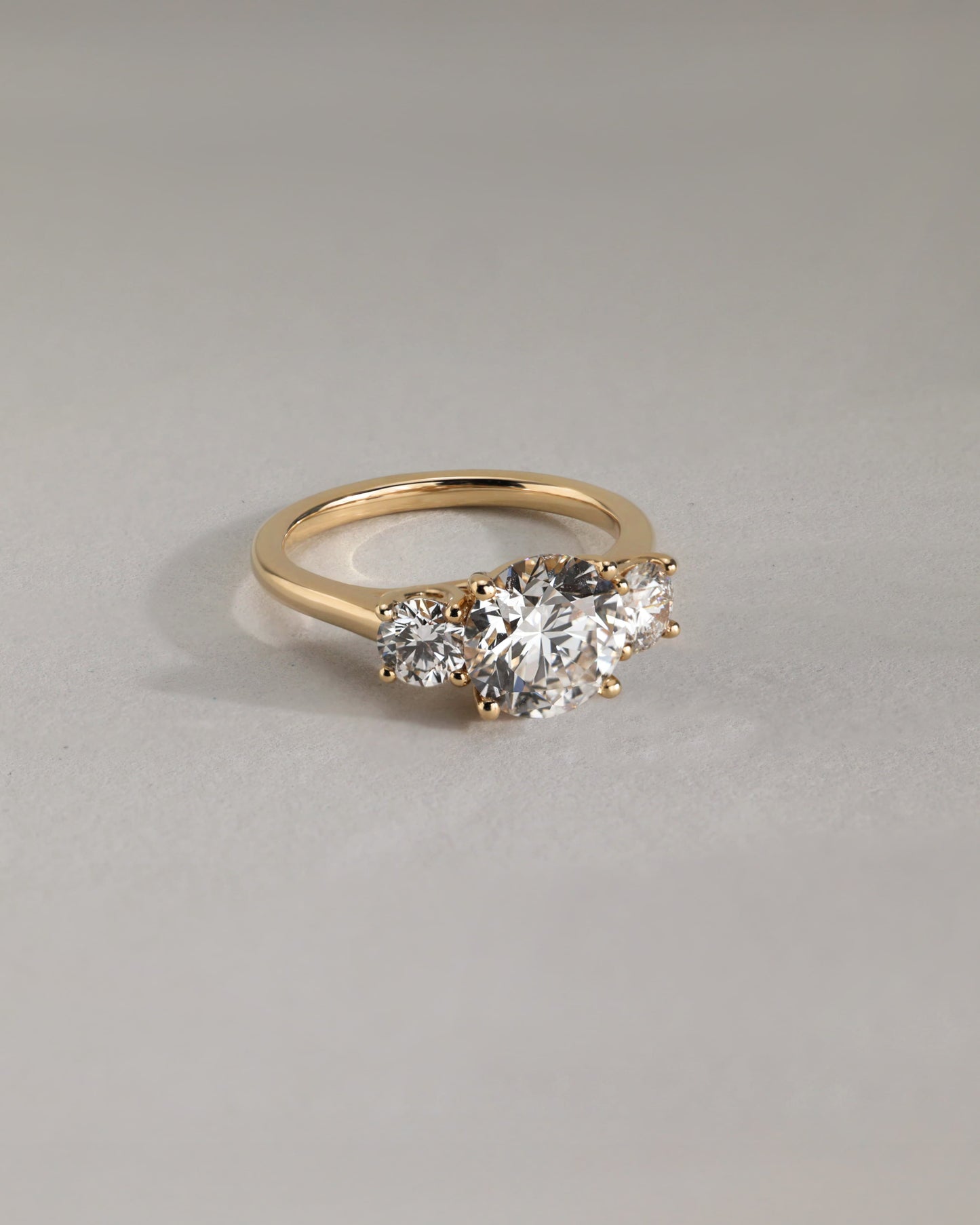Octavia - Round Claw Trilogy with Round Side Stones and Trellis Gallery Engagement Ring - White Gold