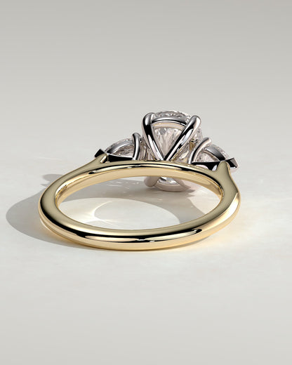 Cataleya - Elongated Cushion Claw Trilogy with Pear Side Stones and Cathedral Setting Engagement Ring - Yellow Two-Tone