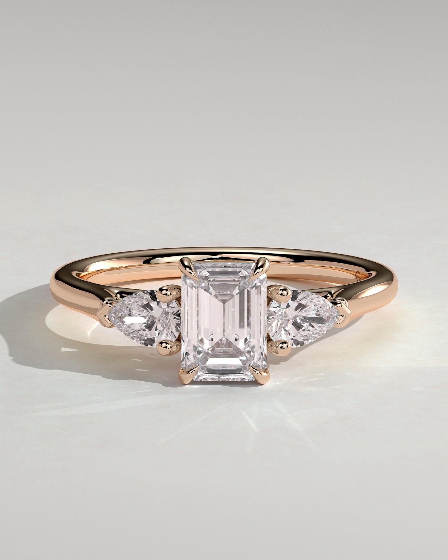 Davina - Emerald Claw Trilogy with Pear Side Stones and Cathedral Setting Engagement Ring - Rose Gold