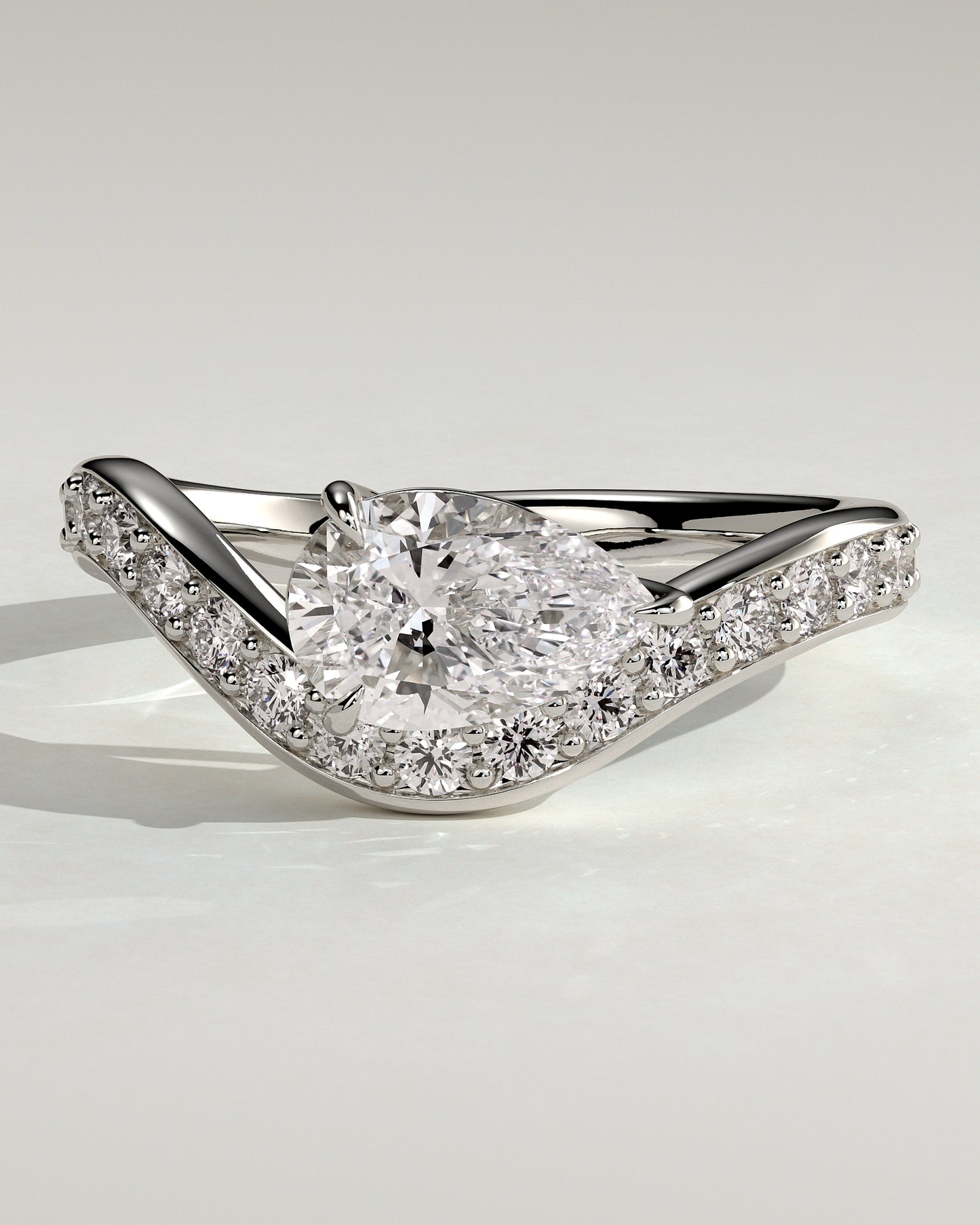 Eliza - Pear Claw Solitaire with Bead Set Pave Wave Band and East West Setting Engagement Ring - Platinum