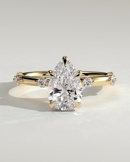 Amora - Pear Claw Solitaire with 6 Spaced Round Accent Stones and Hidden Halo Engagement Ring - Yellow Gold