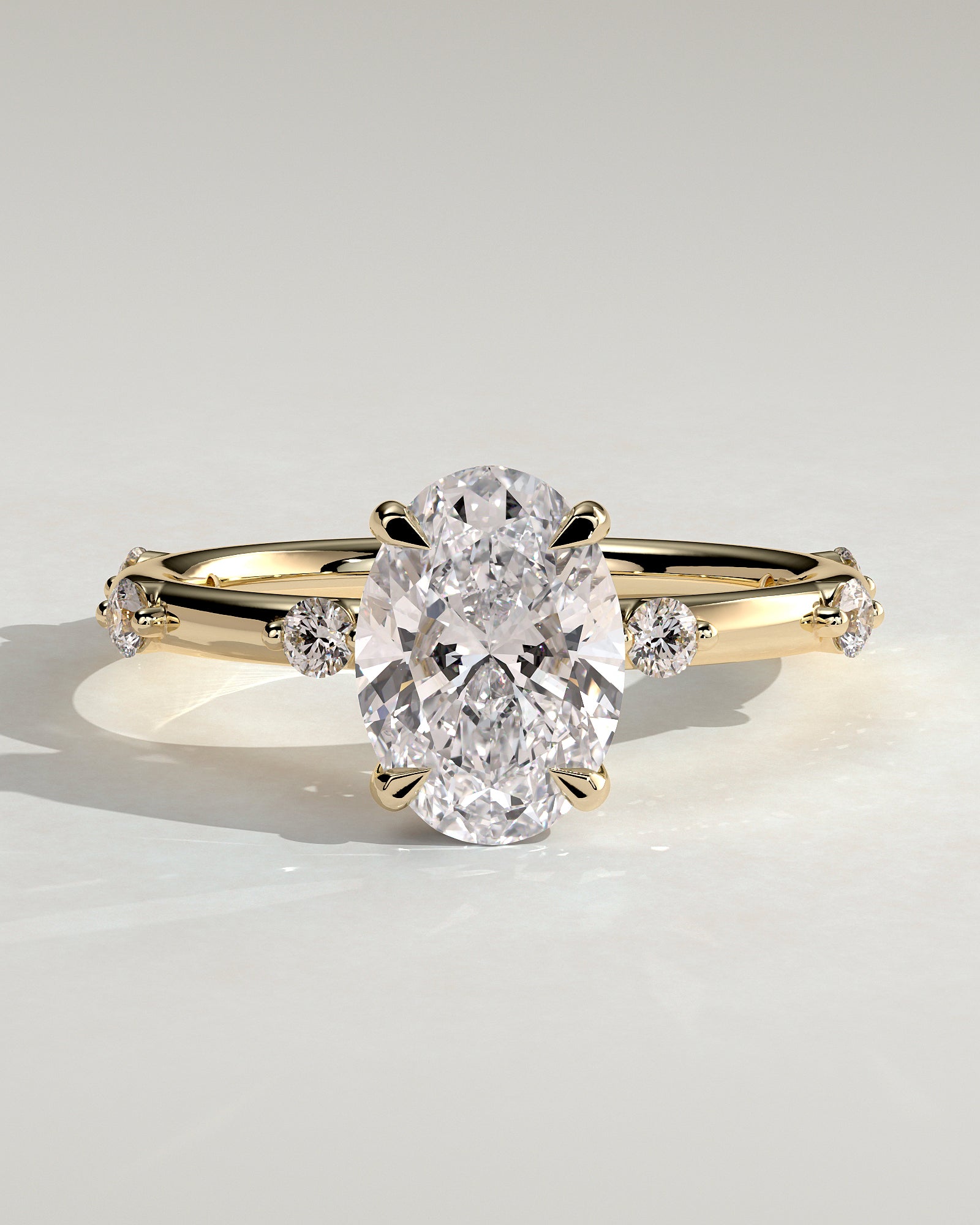 Elise - Oval Claw Solitaire with 6 Spaced Round Accent Stones and Hidden Halo Engagement Ring - Yellow Gold - Yellow Gold 2ct