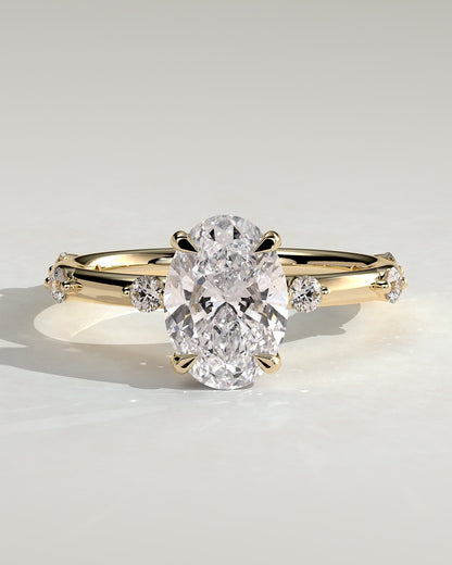 Elise - Oval Claw Solitaire with 6 Spaced Round Accent Stones and Hidden Halo Engagement Ring - Yellow Gold