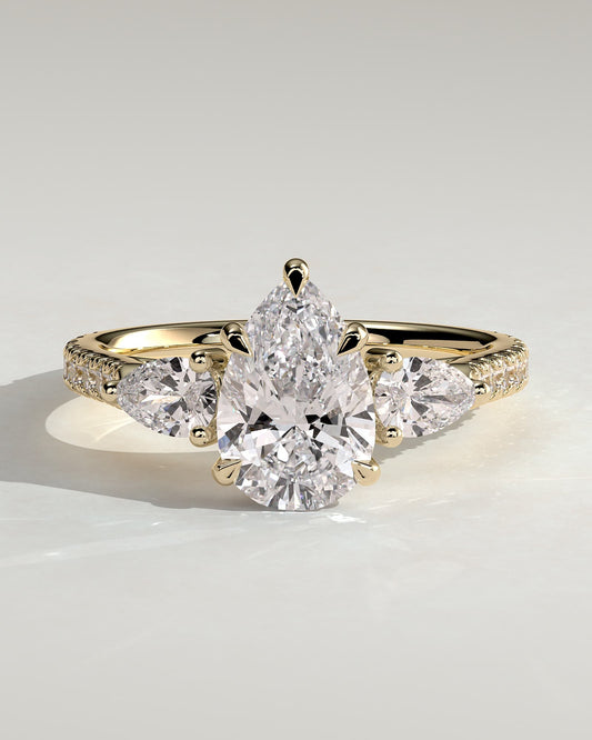 Mia - Pear Claw Trilogy with Pear Side Stones, Pave Band and Cathedral High Setting Engagement Ring - Yellow Gold