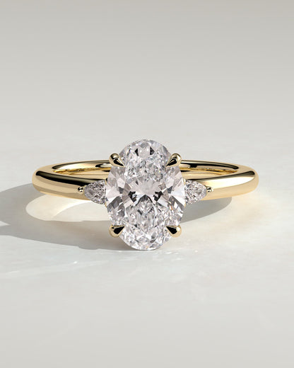Elena - Oval Claw Trilogy with Pear Side Stones and Tulip Detail Engagement Ring - Yellow Gold