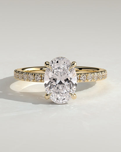 Evangeline - Oval Claw Solitaire with Wrap Around Hidden Halo and Pave Band Engagement Ring - Yellow Gold