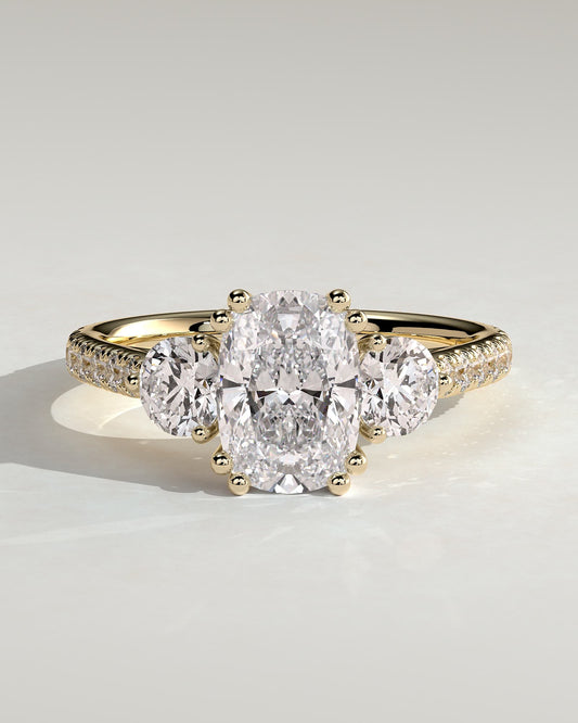 Meghan - Elongated Cushion Double Claw Trilogy with Round Side Stones, Pave Band and Cathedral Setting Engagement Ring - Yellow Gold