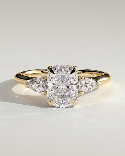 Cataleya - Elongated Cushion Claw Trilogy with Pear Side Stones and Cathedral Setting Engagement Ring - Yellow Gold