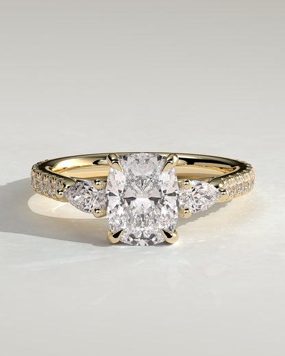 Bree - Elongated Cushion Claw Trilogy with Pear Side Stones and Pave Band Engagement Ring - Yellow Gold