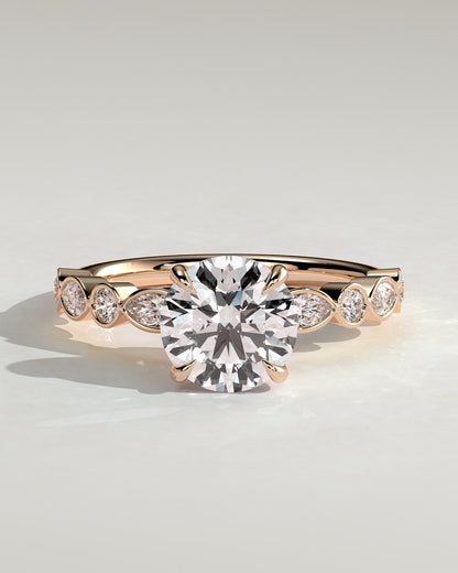 Cartia - Round Claw Solitaire with Round-Marquise Bezel Accent Stones Engagement Ring - Rose Gold