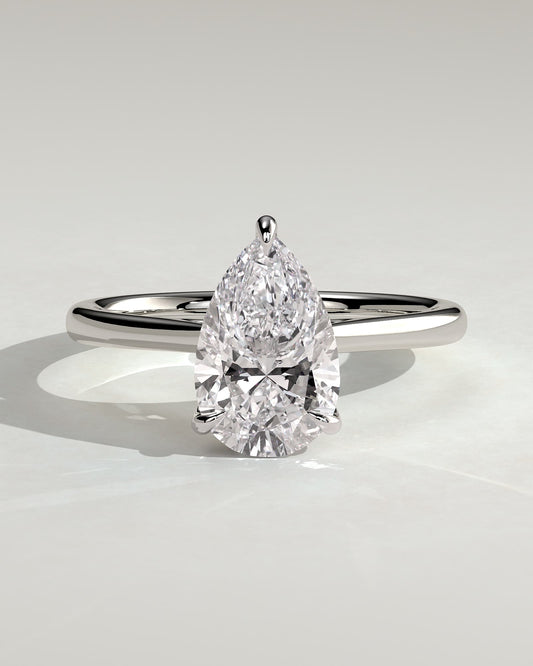 Courtney - Pear Claw Solitaire with Hidden Halo, Tapered Band and Cathedral High Setting Engagement Ring - White Gold