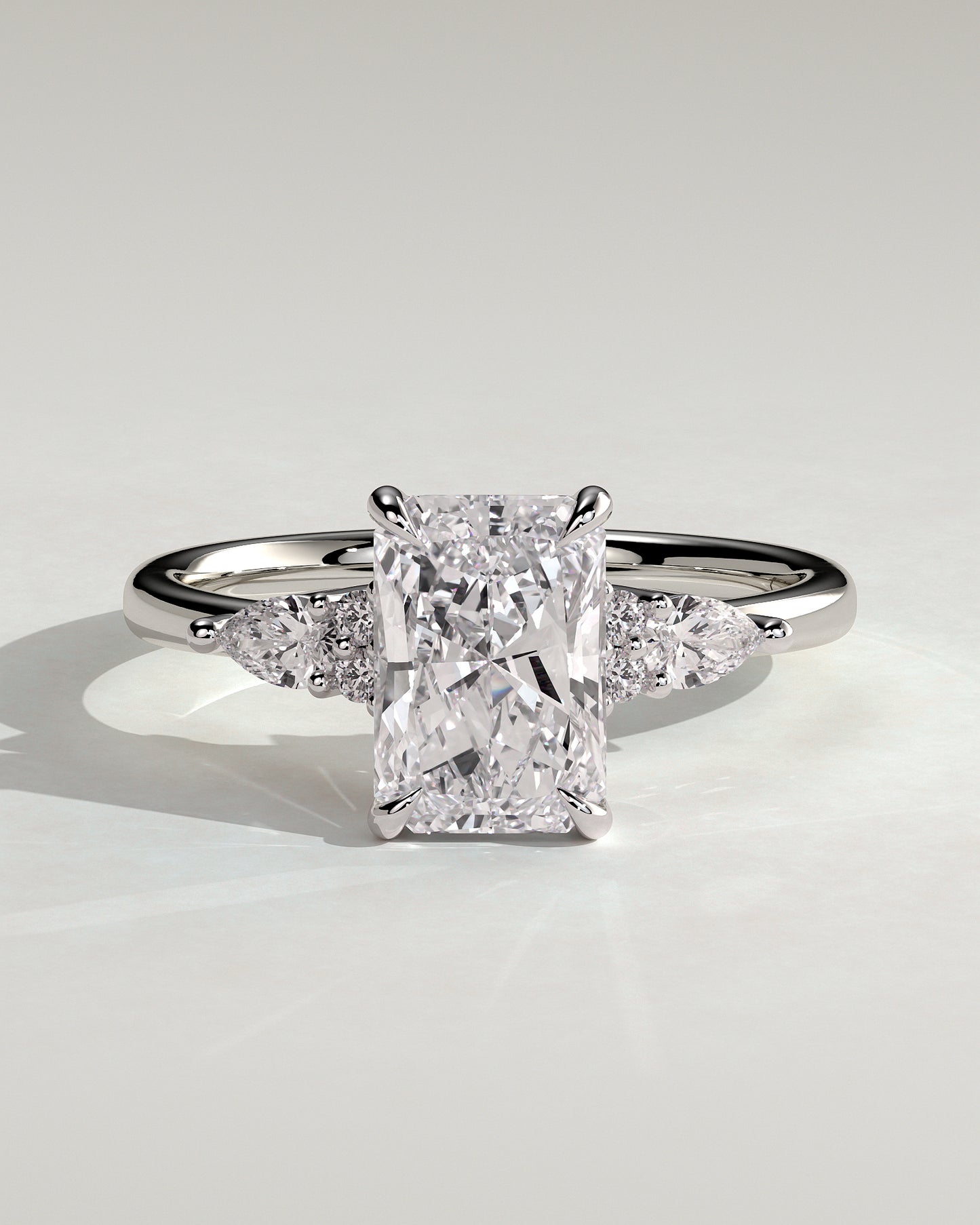 Heidi - Radiant Claw Solitaire with Pear Accents and Round Shoulder Stones Engagement Ring - Platinum - White Gold / Platinum 2ct