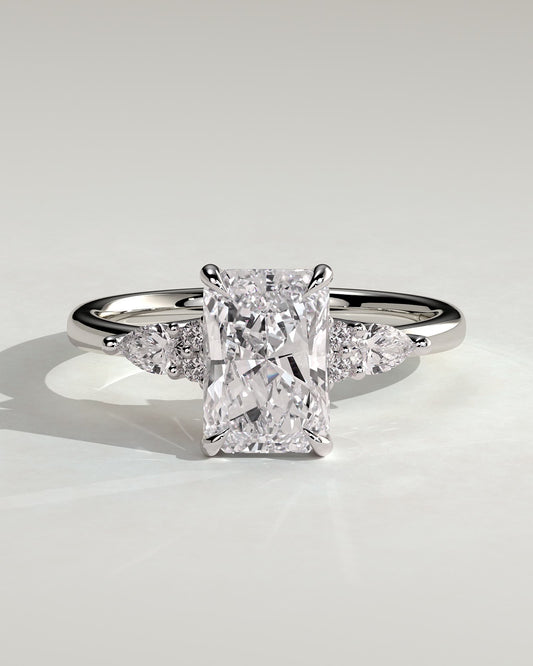 Heidi - Radiant Claw Solitaire with Pear Accents and Round Shoulder Stones Engagement Ring - Platinum