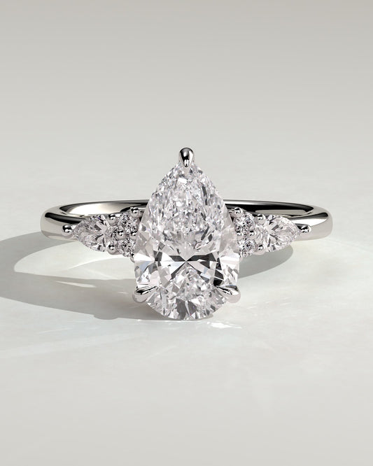 Lindsay - Pear Claw Solitaire with Pear Accents and Round Shoulder Stones Engagement Ring - Platinum