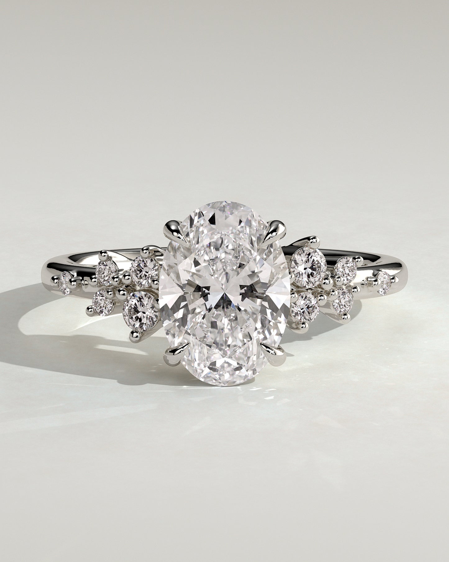Bella - Oval Claw Solitaire with Clustered Round Shoulder Stones Engagement Ring - Platinum - White Gold / Platinum 2ct