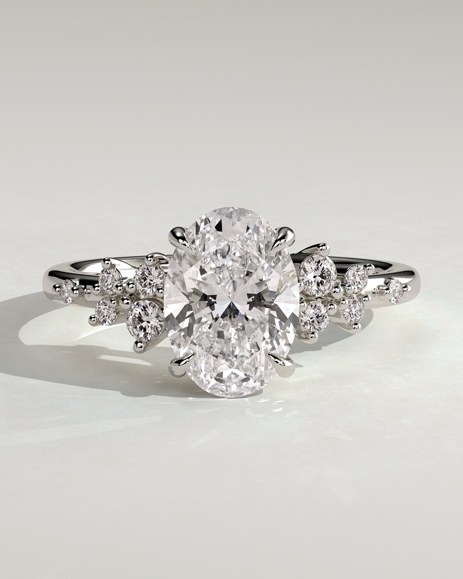 Bella - Oval Claw Solitaire with Clustered Round Shoulder Stones Engagement Ring - Platinum - White Gold / Platinum 2ct