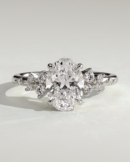 Bella - Oval Claw Solitaire with Clustered Round Shoulder Stones Engagement Ring - Platinum