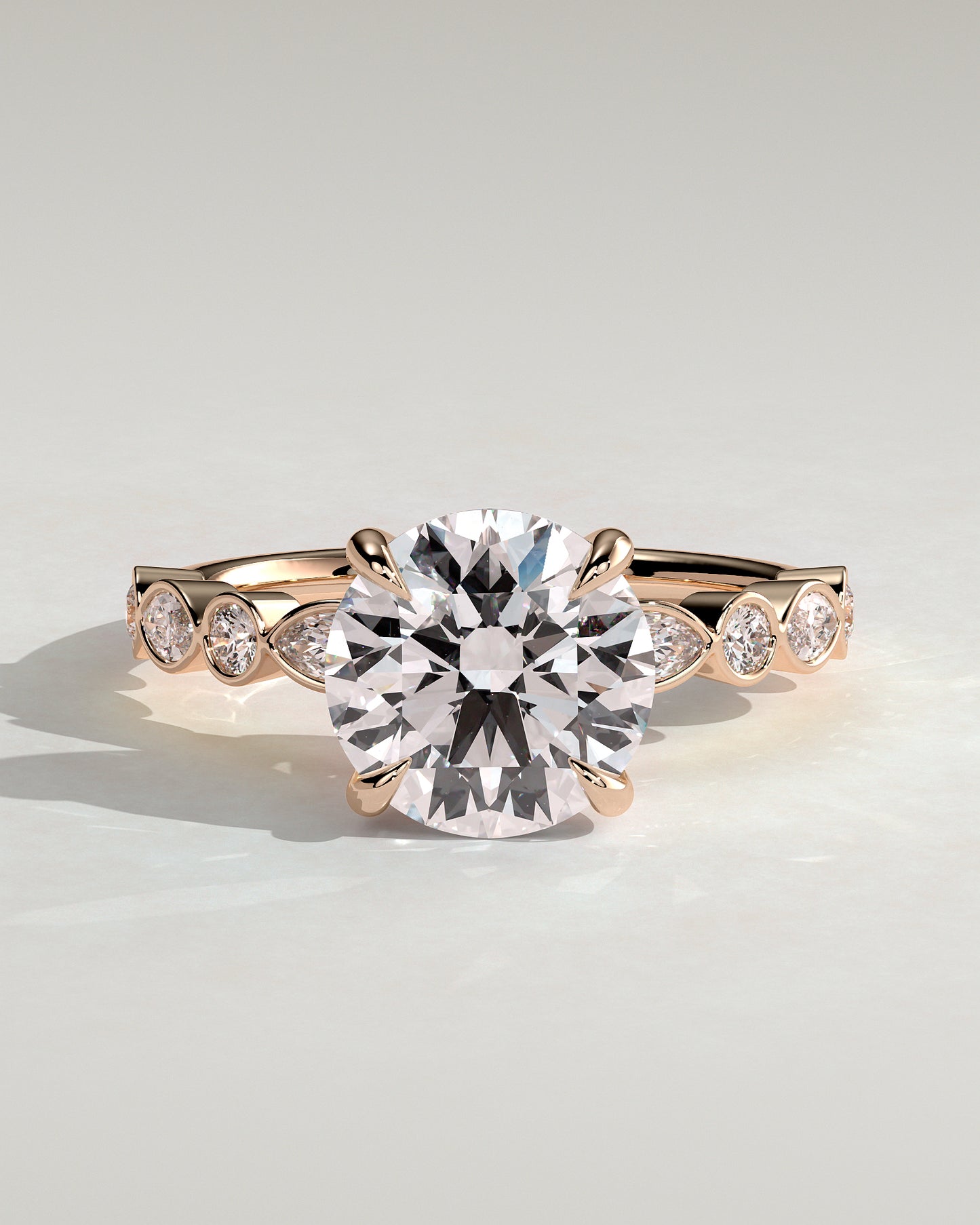 Cartia - Round Claw Solitaire with Round-Marquise Bezel Accent Stones Engagement Ring - Rose Gold