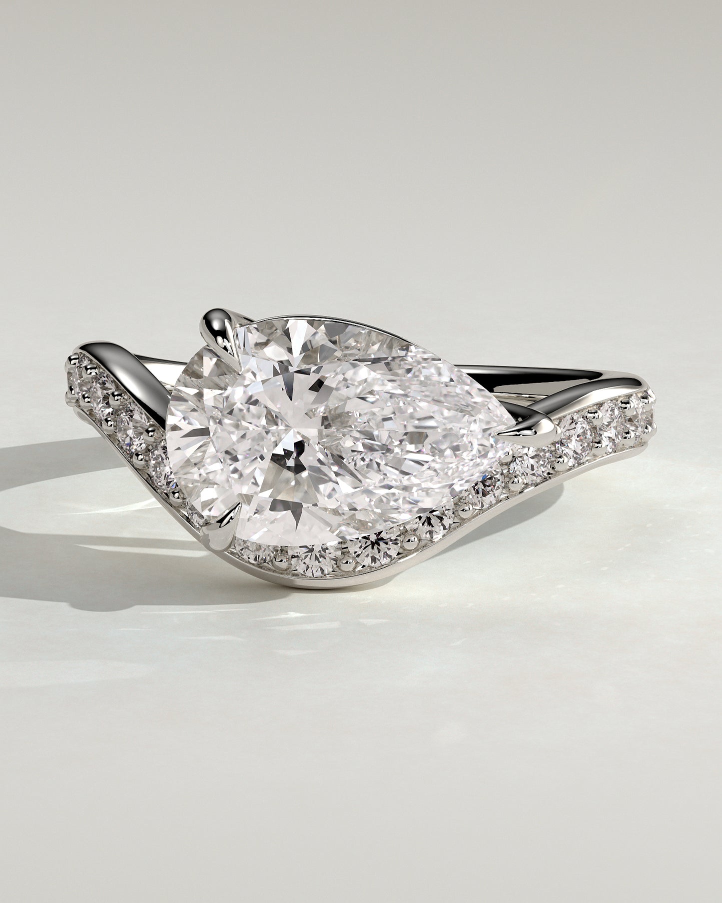 Eliza - Pear Claw Solitaire with Bead Set Pave Wave Band and East West Setting Engagement Ring - Platinum