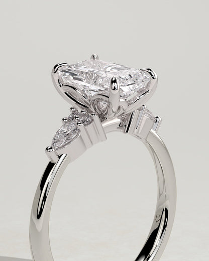 Heidi - Radiant Claw Solitaire with Pear Accents and Round Shoulder Stones Engagement Ring - White Gold