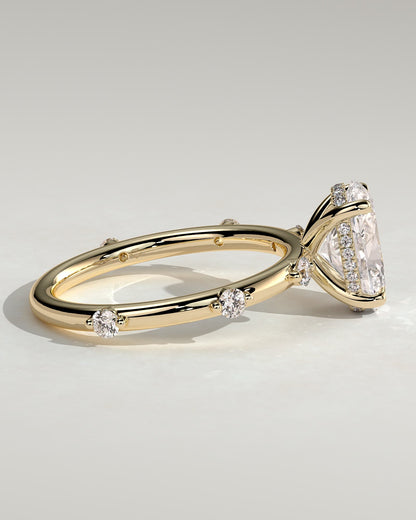 Elise - Oval Claw Solitaire with 6 Spaced Round Accent Stones and Hidden Halo Engagement Ring - Yellow Gold