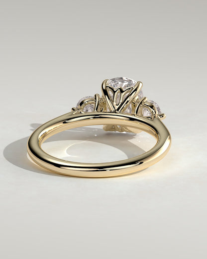Charmaine - Elongated Cushion Claw Trilogy with Round Side Stones and Lily Detail Engagement Ring - Yellow Gold