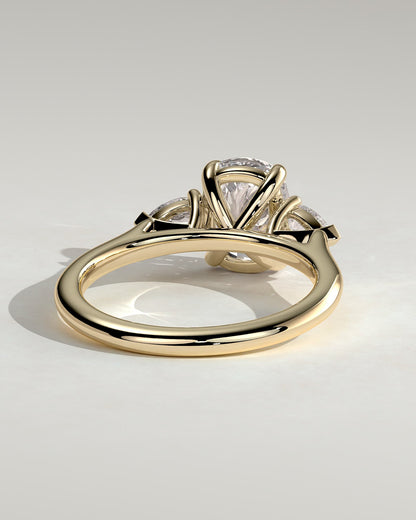 Cataleya - Elongated Cushion Claw Trilogy with Pear Side Stones and Cathedral Setting Engagement Ring - Yellow Gold