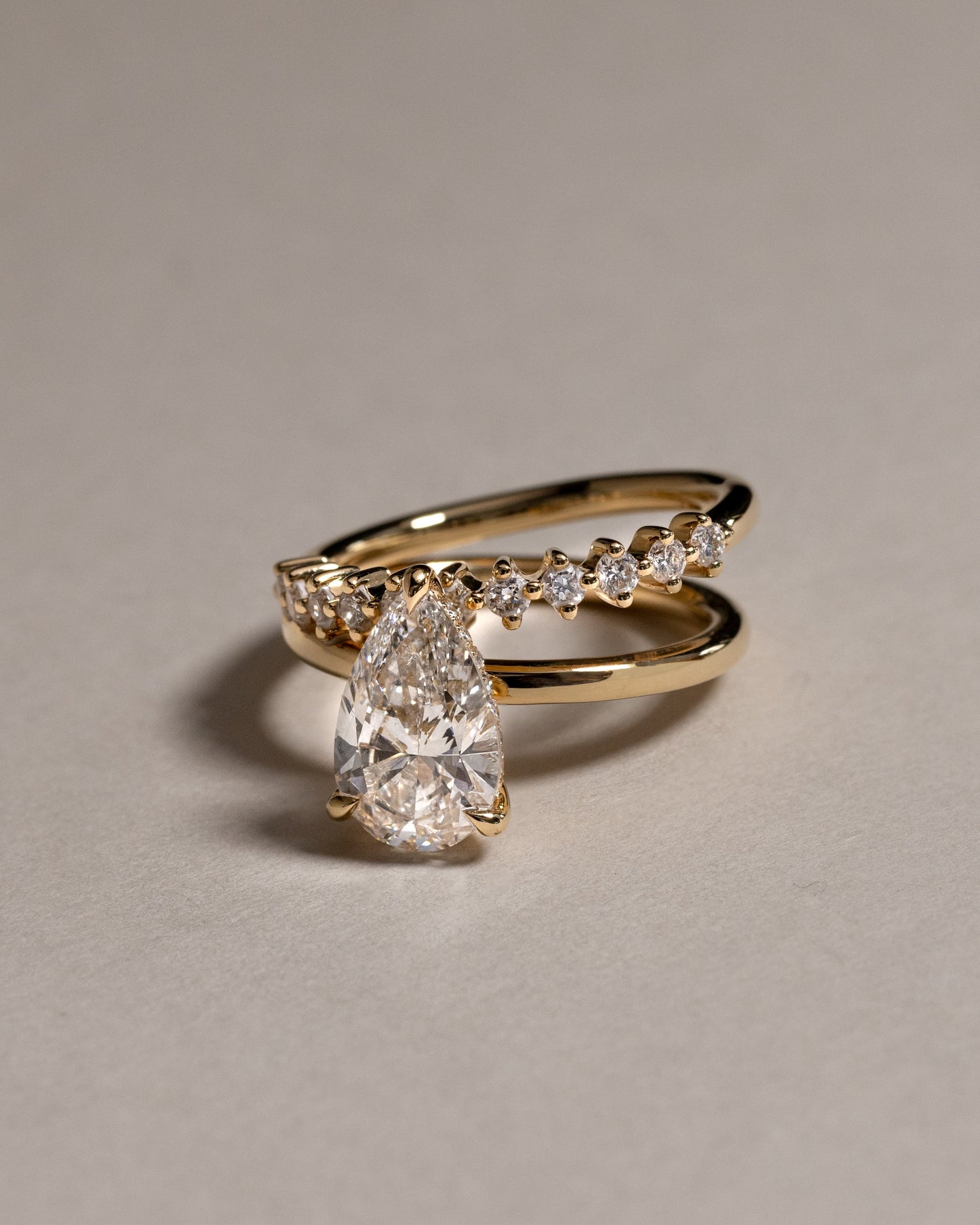 Xanthe - Pear Claw Solitaire with Double Plain-and-Round-Accent Stones Band Engagement Ring - Platinum