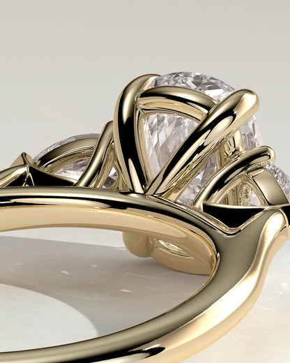 Cataleya - Elongated Cushion Claw Trilogy with Pear Side Stones and Cathedral Setting Engagement Ring - Yellow Gold