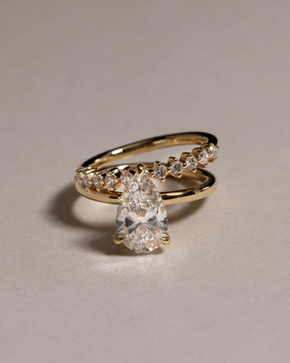 Xanthe - Pear Claw Solitaire with Double Plain-and-Round-Accent Stones Band Engagement Ring - Platinum