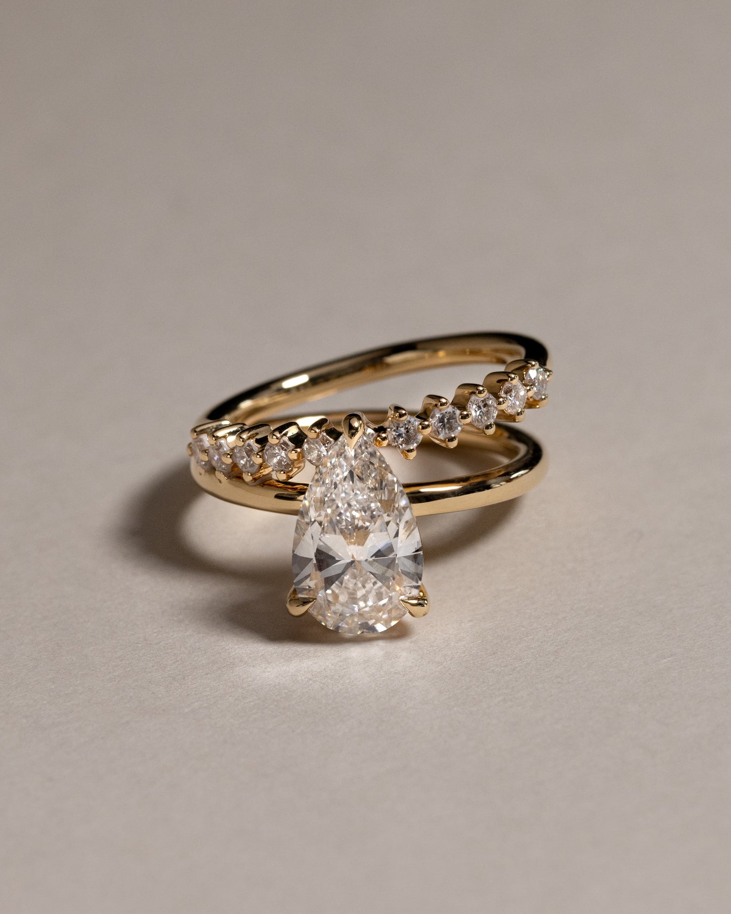Xanthe - Pear Claw Solitaire with Double Plain-and-Round-Accent Stones Band Engagement Ring - White Gold