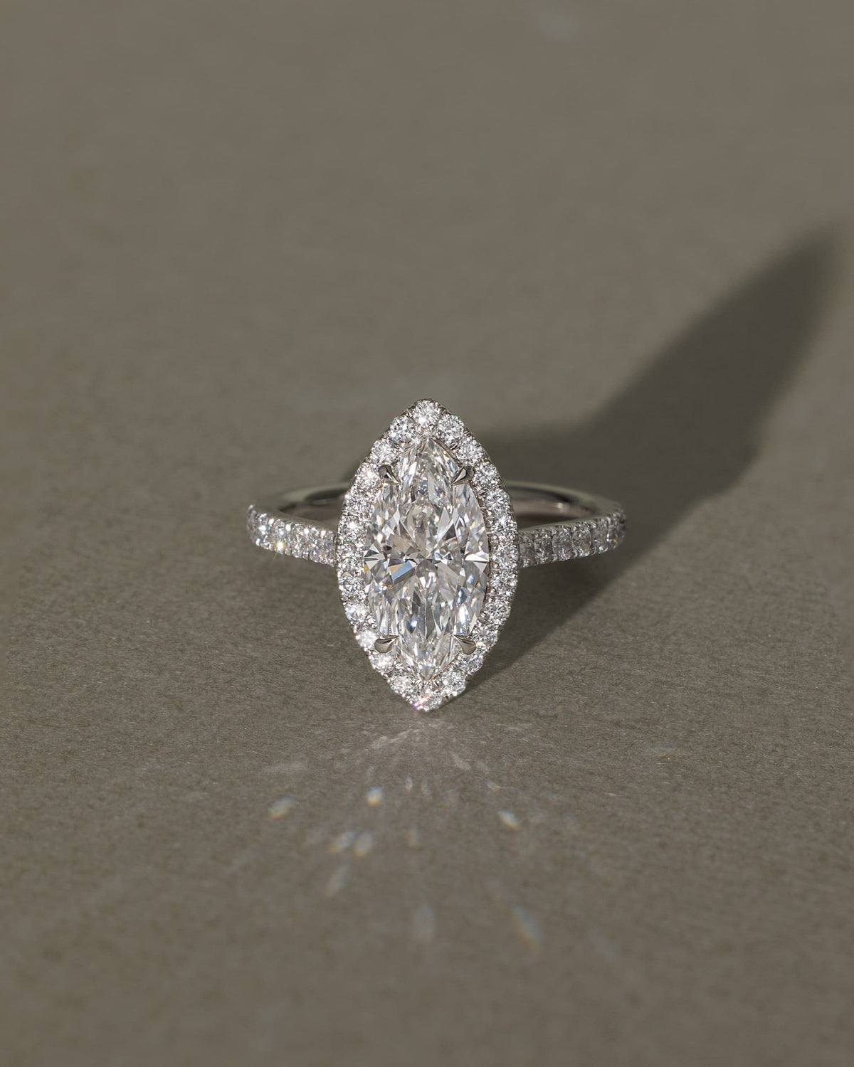 Stefania - Marquise Claw Solitaire with Halo and Pave Band and Cathedral High Setting Engagement Ring - Platinum
