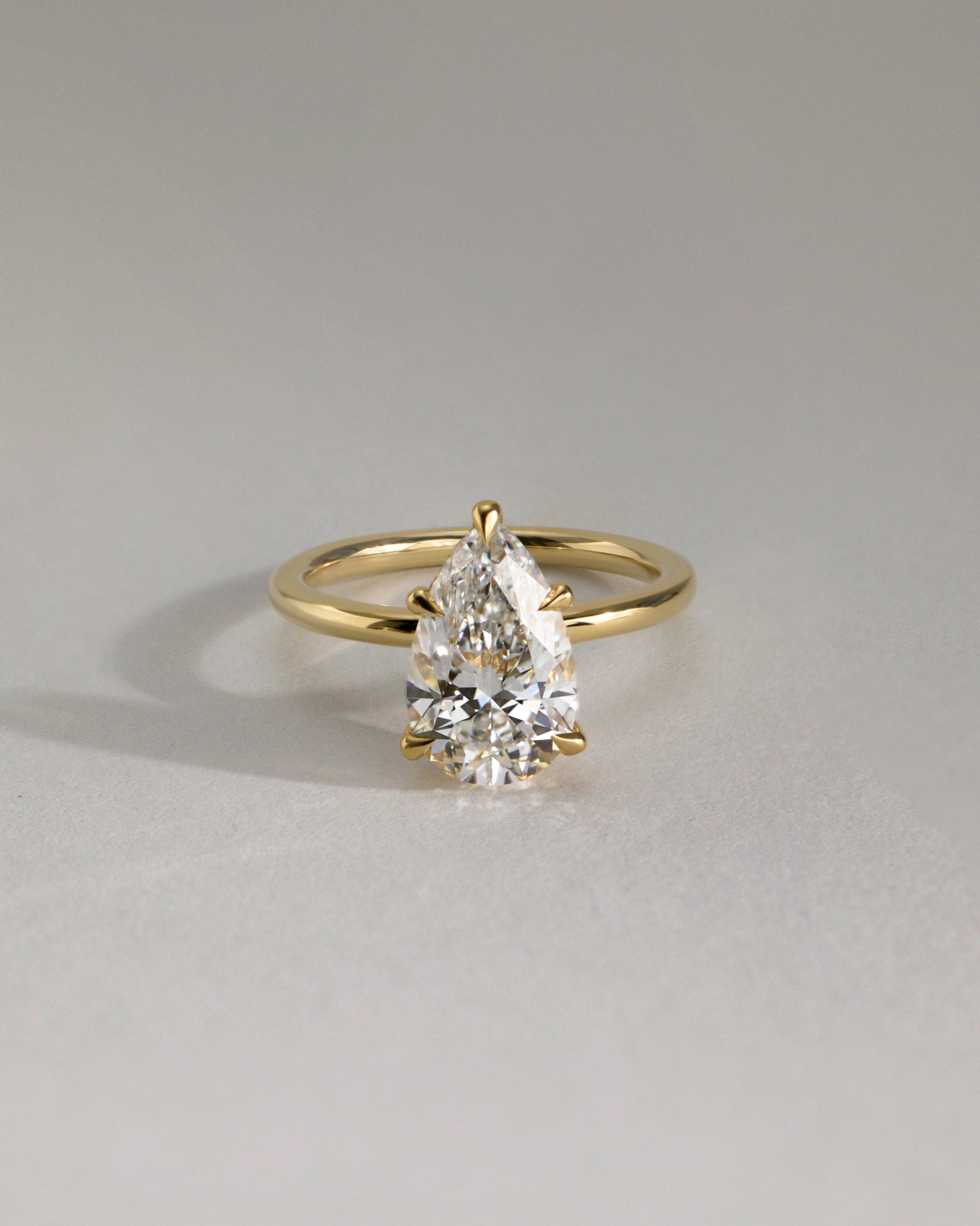 Ainsley - Pear Claw Solitaire with Wrap Around Hidden Halo Engagement Ring - Rose Two-Tone - Lifestyle
