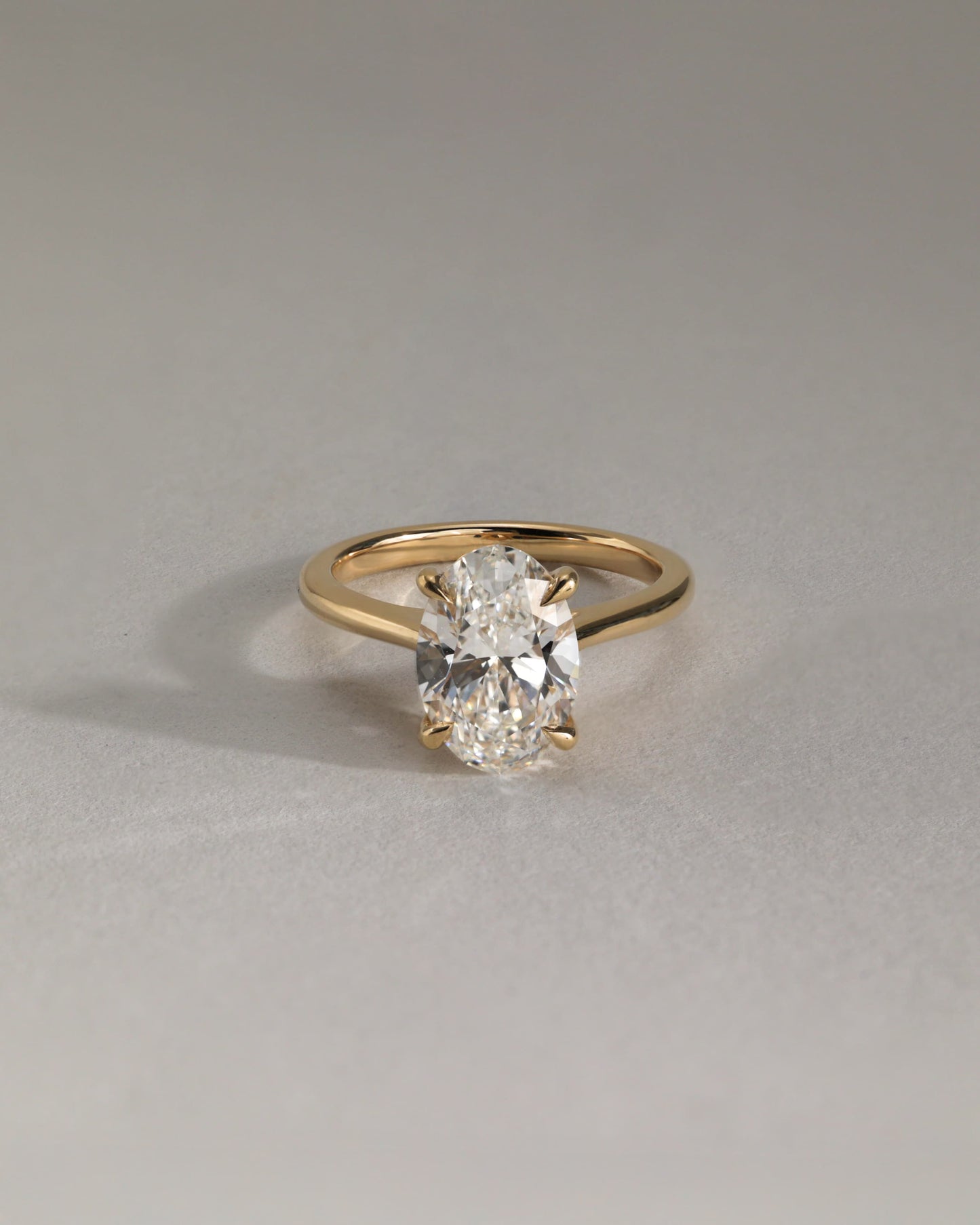 Bethany - Oval Claw Solitaire with Hidden Halo, Tapered Band and Cathedral High Setting Engagement Ring - White Gold