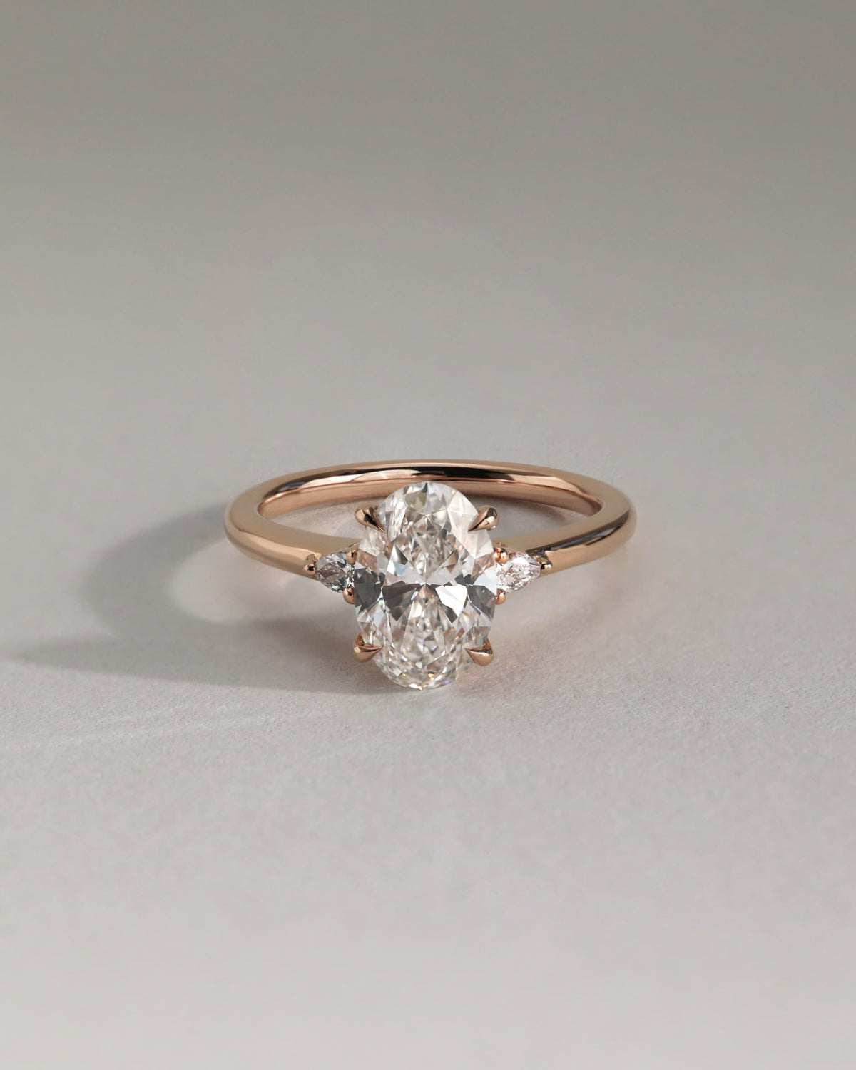 Elena - Oval Claw Trilogy with Pear Side Stones and Tulip Detail Engagement Ring - Rose Gold
