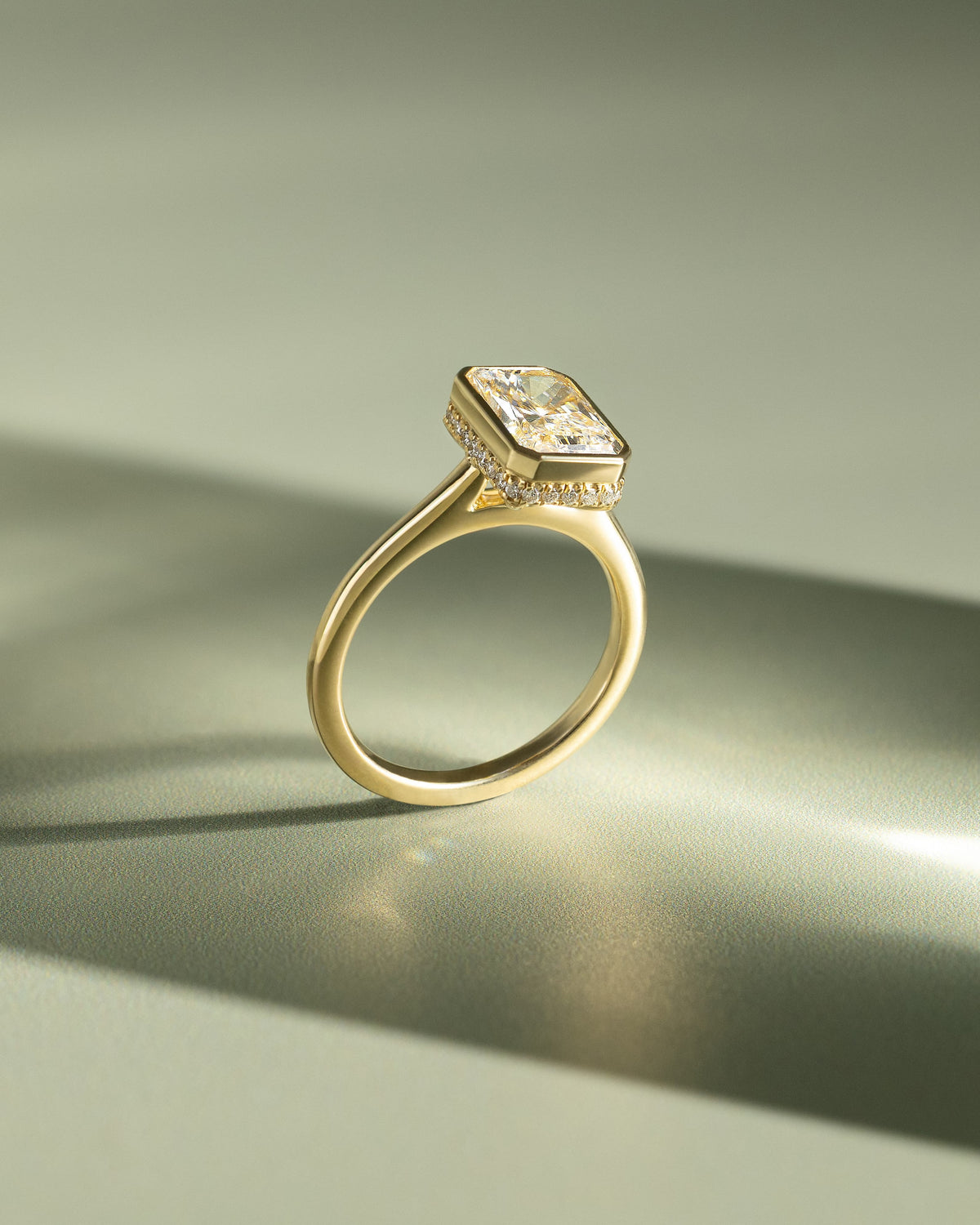 Bennie - Radiant Bezel Solitaire with Hidden Halo and Cathedral High Setting Engagement Ring - Yellow Gold